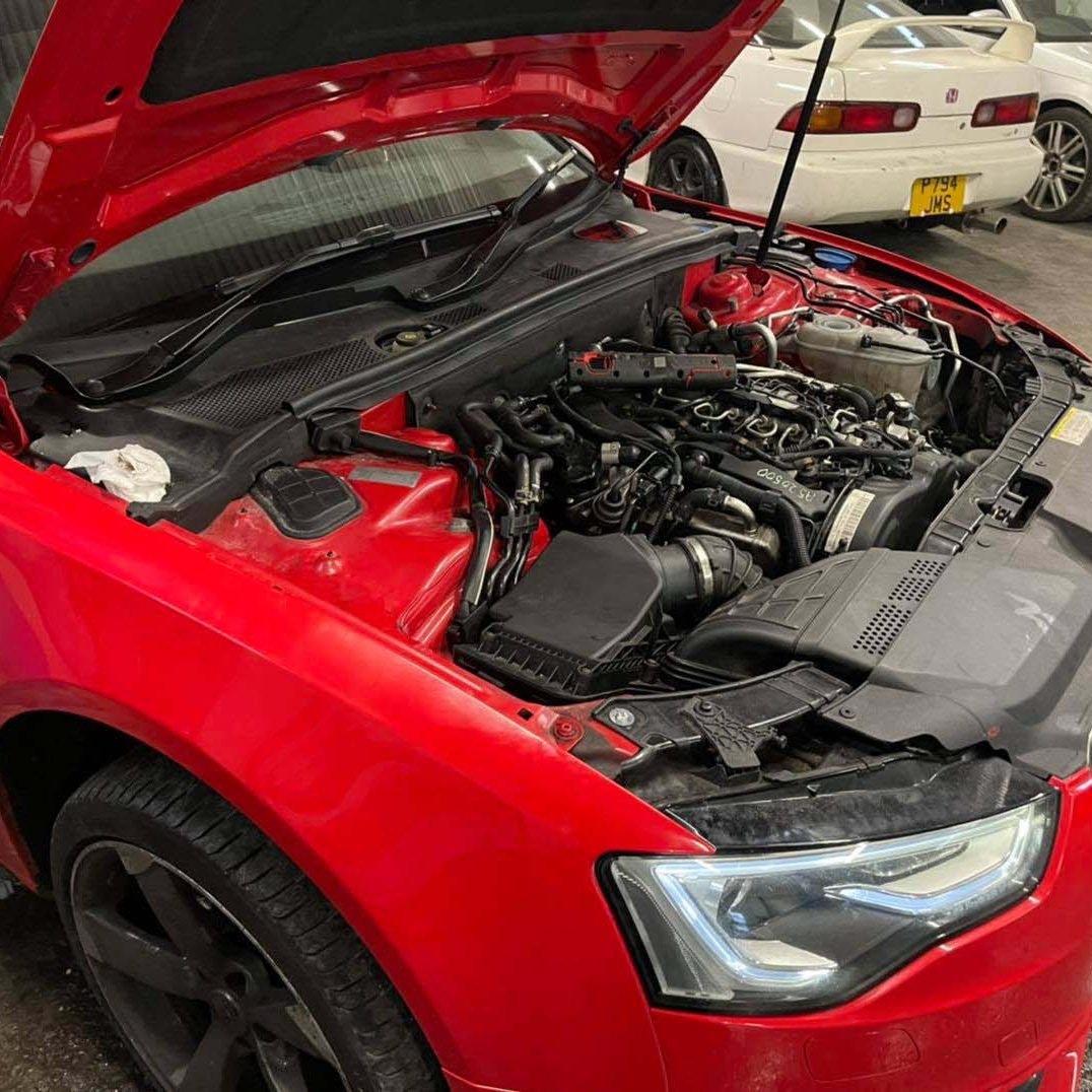 Red Audi getting serviced